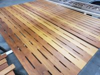 Slatted wood panel finished to enhance natural color variation and grain definition Custom slatted wood panel finished in a natural clear coat highlighting varied wood tones by Leone’s Custom Coatings.