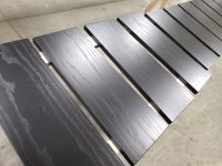 Batch-finished wood panels with a rich dark stain and consistent sheen. Custom wood panels finished with a smooth dark stain and protective clear coat by Leone’s Custom Coatings.