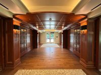 Architectural interior with premium wood finishing services by Leone’s Custom Coatings — enhancing millwork, ceilings, and hardwood surfaces. Interior hallway with premium custom wood finishing, coffered ceiling, and hardwood floors by Leone’s Custom Coatings.