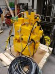 Hydraulic power unit coated for durability and corrosion resistance by Leone’s Custom Coatings. Industrial hydraulic power unit finished with a durable yellow protective coating by Leone’s Custom Coatings in Traverse City, Michigan.