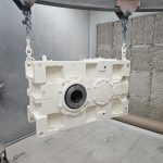 Industrial gearbox housing coated for durability and corrosion resistance by Leone’s Custom Coatings. Industrial gearbox housing finished with a durable white protective coating by Leone’s Custom Coatings in Traverse City, Michigan.